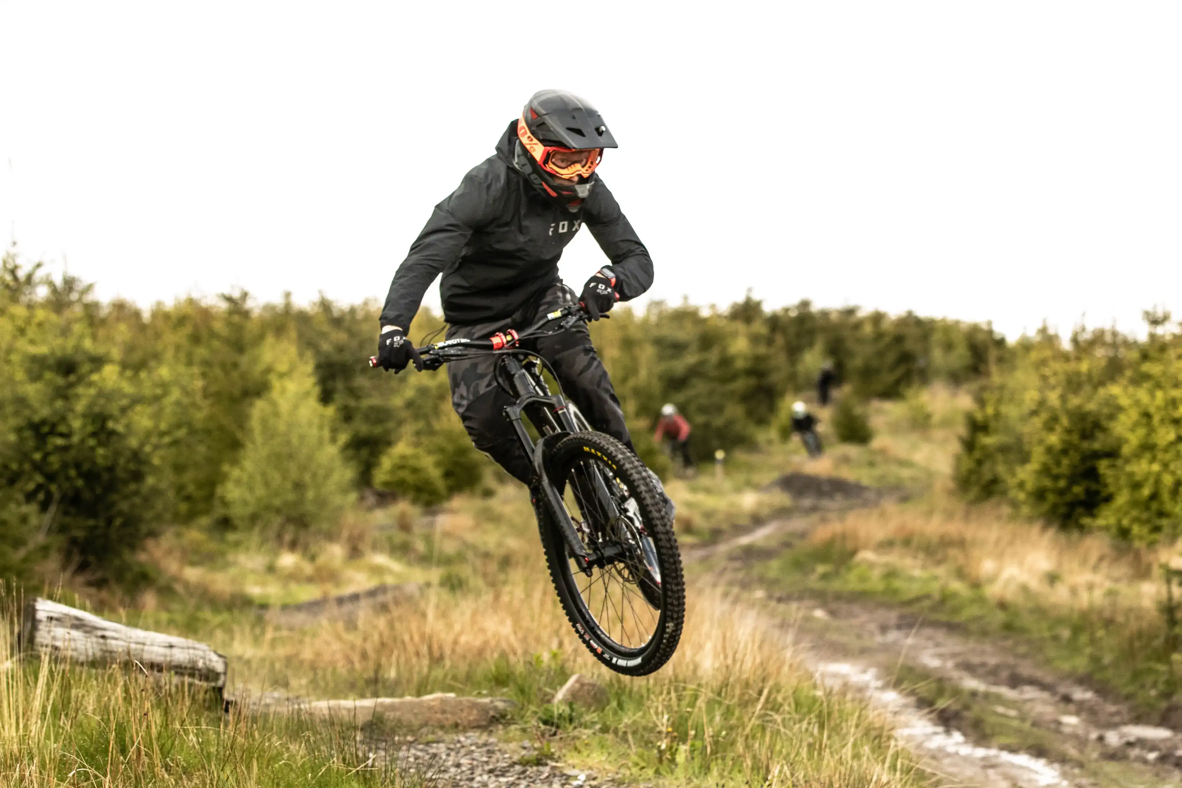 Me throwing a whip on my mountain bike at Bikepark Wales on a typically wet Welsh day in Autumn